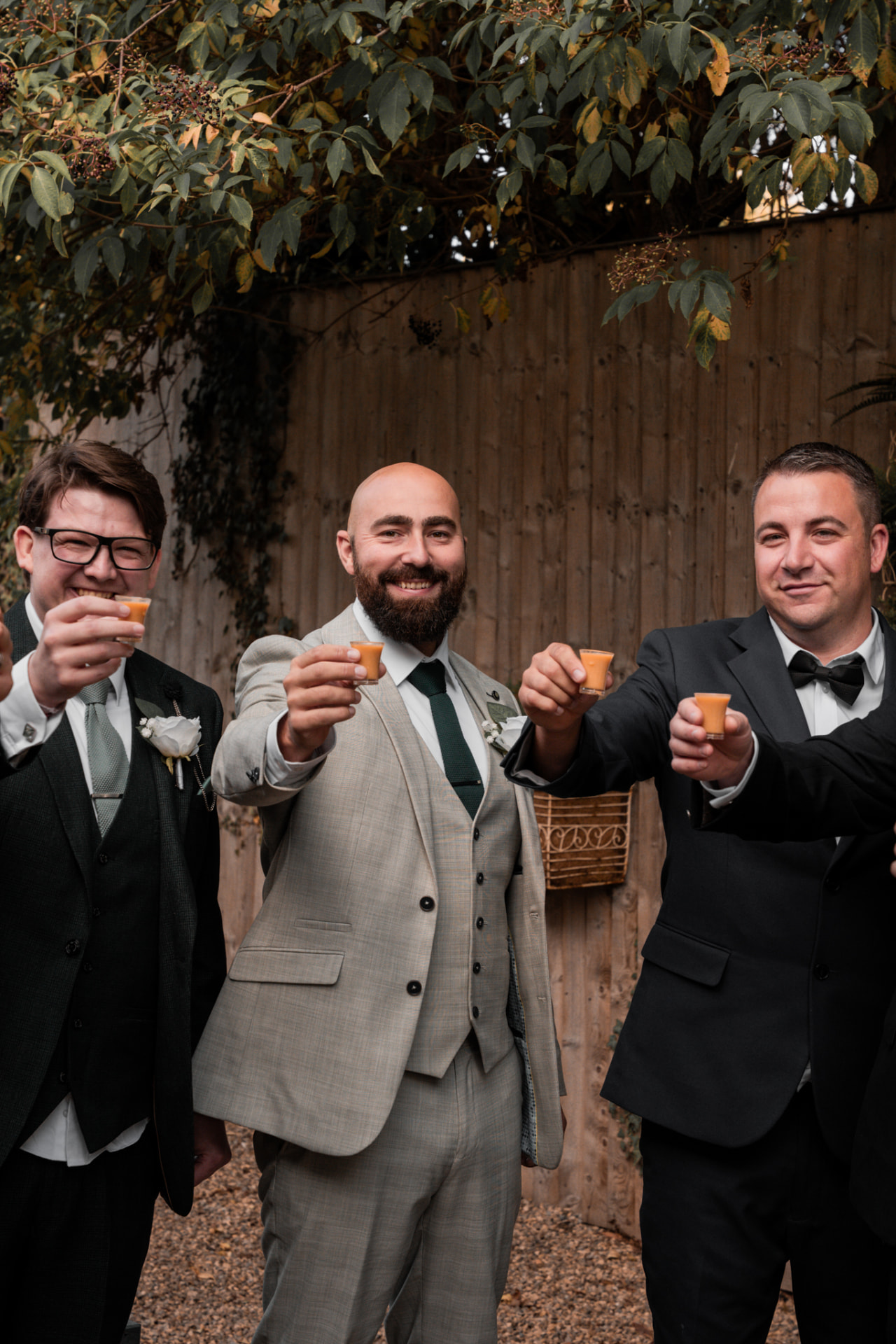 Groom and groomsmen raising a toast