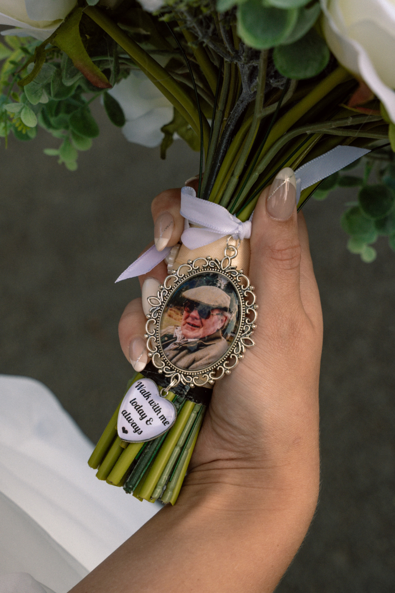 Memory charm reading 'Walk with me today & always' tied to a bridal bouquet